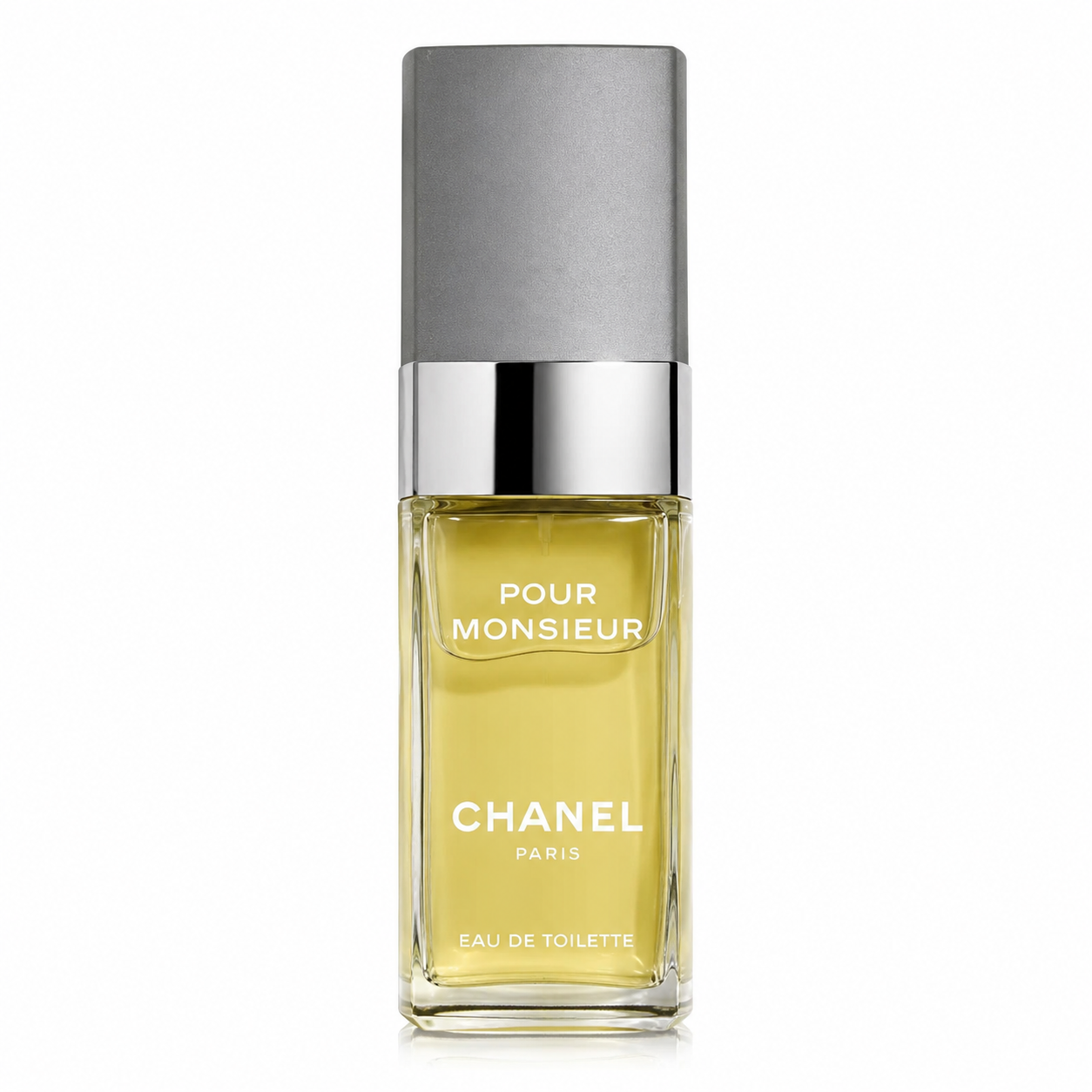 Chanel Pour Monsieur Eau de Toilette presented in its classic tall rectangular clear-glass bottle, filled with luminous golden-yellow fragrance. Preserve the exact bottle proportions, transparent beveled glass, white “POUR MONSIEUR / CHANEL PARIS / EAU DE TOILETTE” typography, highly polished silver metallic collar, and tall matte textured grey rectangular cap. Front-facing, perfectly centered and upright against a seamless pure white background.