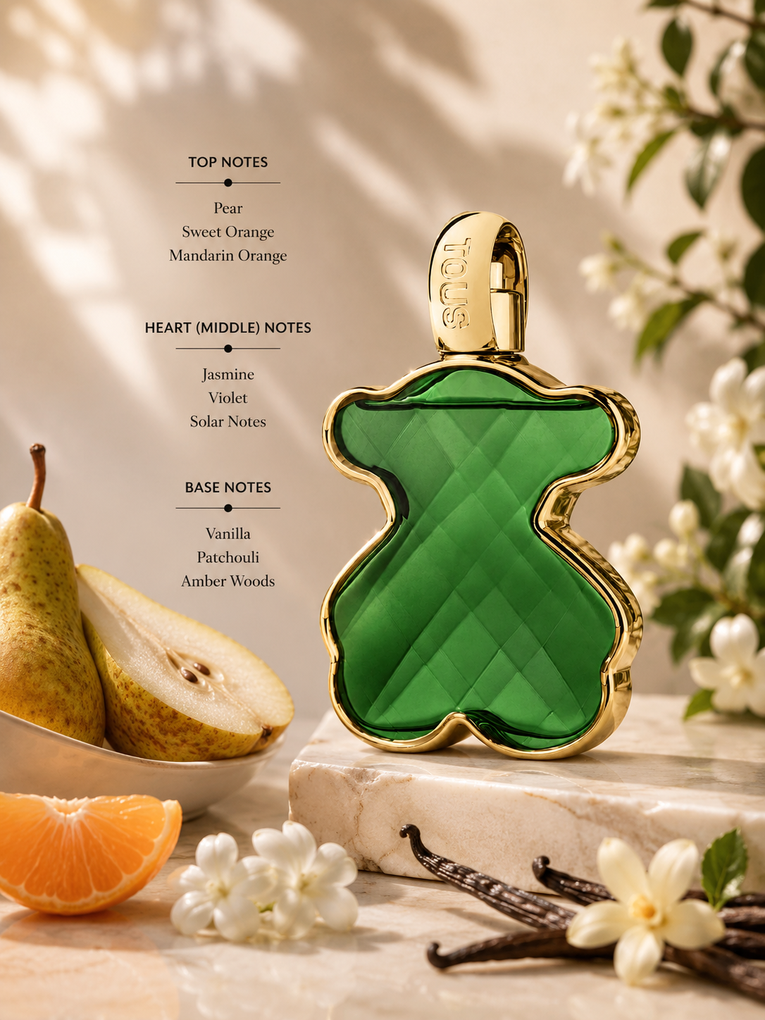 Tous LoveMe The Emerald Elixir displayed with pear, mandarin orange, jasmine, vanilla, and patchouli accents. Notes shown:
Top: Pear, Sweet Orange, Mandarin Orange
Heart: Jasmine, Violet, Solar Notes
Base: Vanilla, Patchouli, Amber Woods
A radiant fruity-floral fragrance with warm woody undertones, presented in the signature emerald-green jewel-inspired bear bottle.