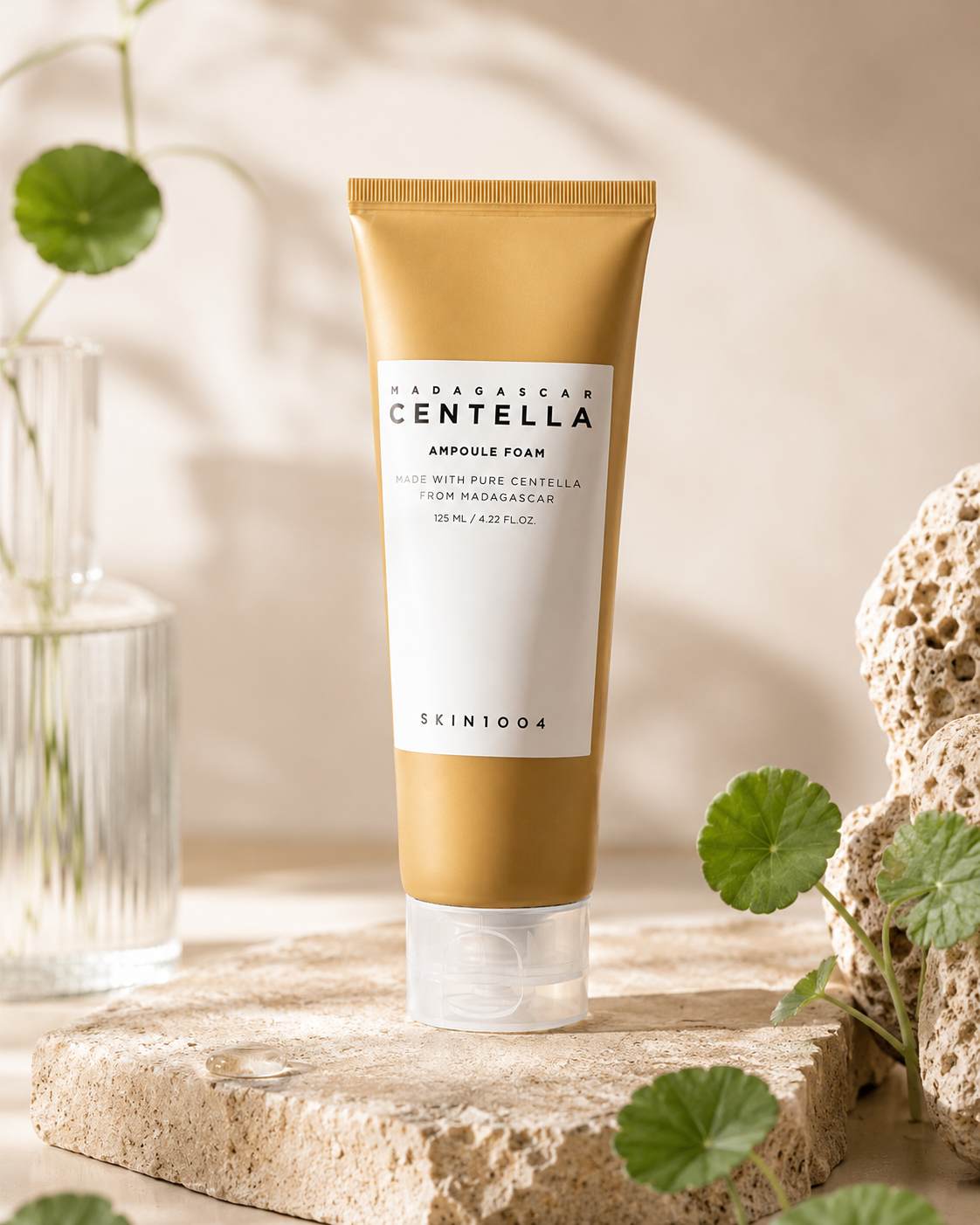Skin1004 Madagascar Centella Ampoule Foam 125ml on a natural stone surface with plants.
