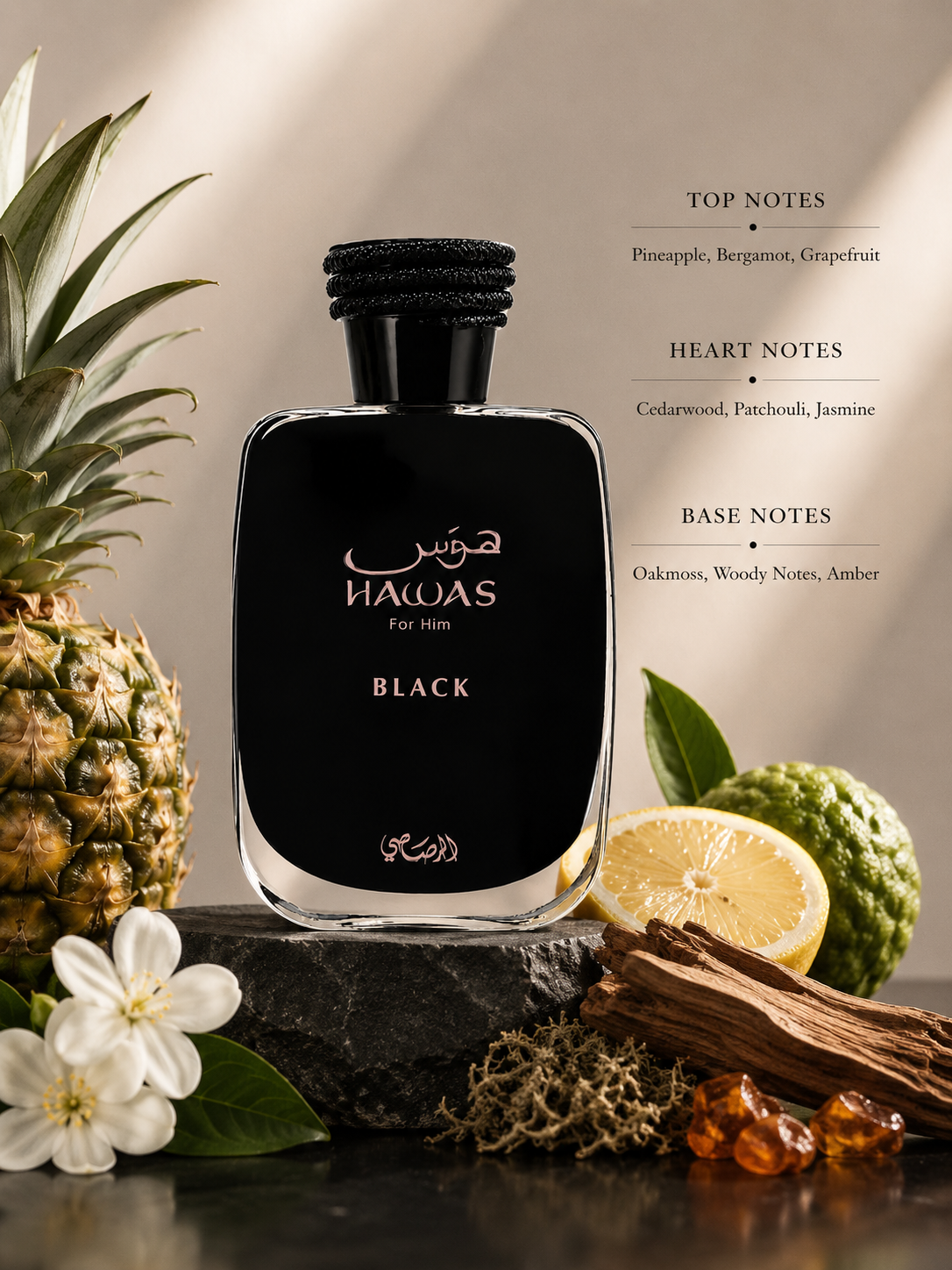 Rasasi Hawas Black For Him displayed with pineapple, bergamot, grapefruit, cedarwood, patchouli, jasmine, oakmoss, woody notes, amber, and fragrance notes on a sophisticated natural stone background.