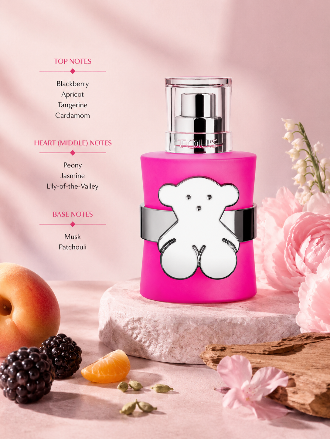 Tous LoveMe The Bright Parfum displayed with blackberry, apricot, jasmine, and patchouli accents. Notes shown:
Top: Blackberry, Apricot, Tangerine, Cardamom
Heart: Peony, Jasmine, Lily-of-the-Valley
Base: Musk, Patchouli
A vibrant fruity-floral fragrance blending juicy berries and apricot with delicate floral notes, resting on a soft musky-patchouli base. Presented in a bold fuchsia bottle featuring the iconic Tous bear emblem.