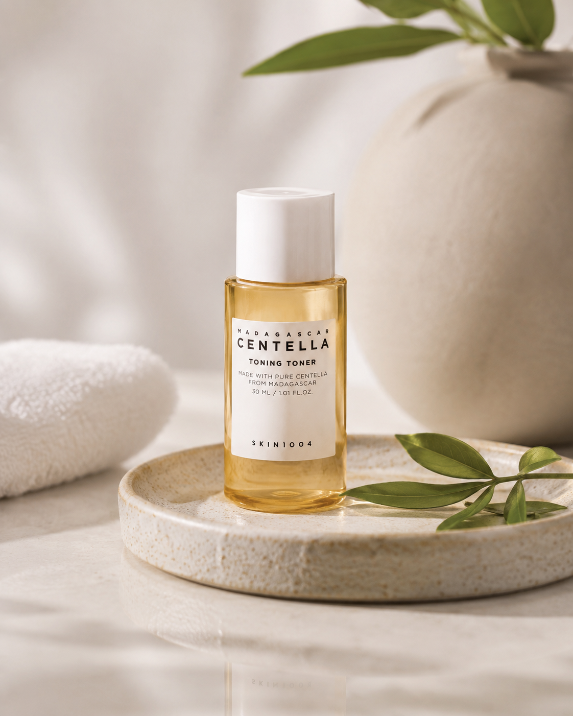 SKIN1004 Madagascar Centella Toning Toner 30ml on a neutral background with decorative elements